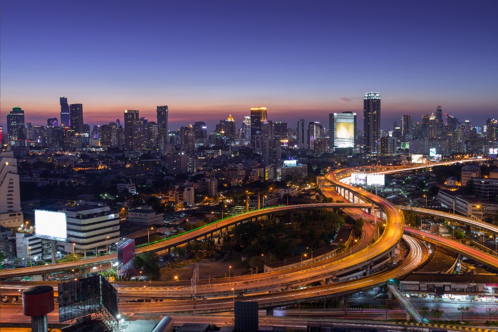 City skyline at night with illuminated highways — representing digital growth for local businesses